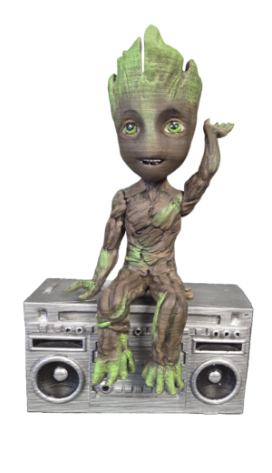 3D printed hand painted Groot Boombox Figure sitting on a silver retro stereo with twin speakers
